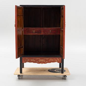 A Chinese lacquered cabinet, 20th century.