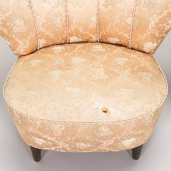 A pair of mid-20th century armchairs.