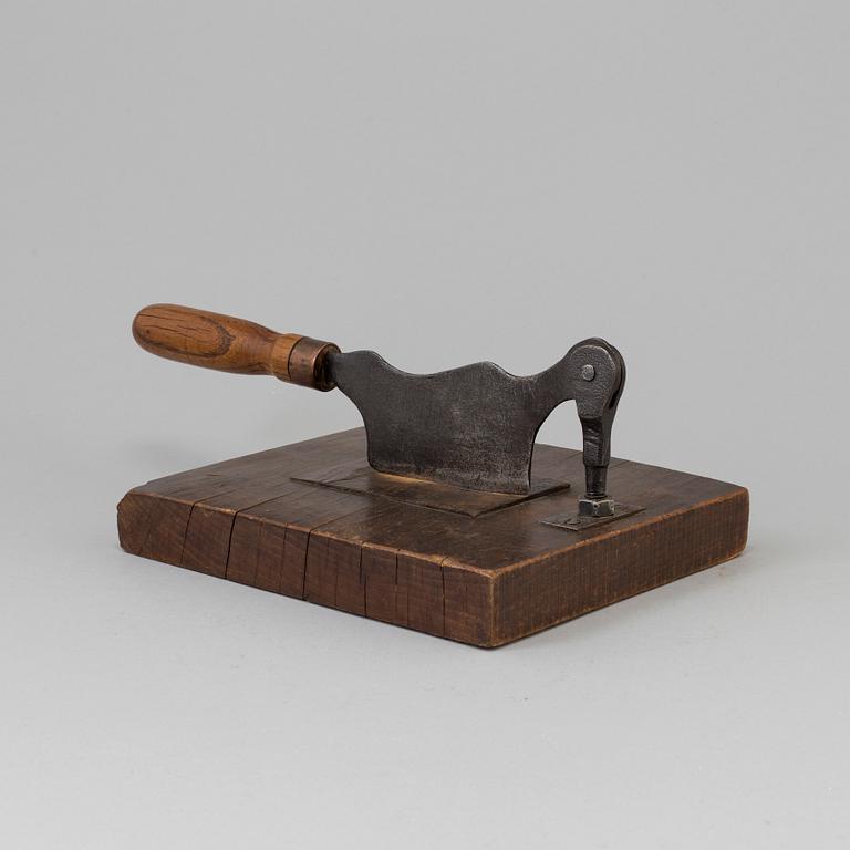 A 19TH CENTURY TOBACCO CUTTER, wood and iron.