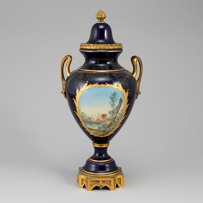 A French porcelain and gilt bronze urn with cover, 20th century.