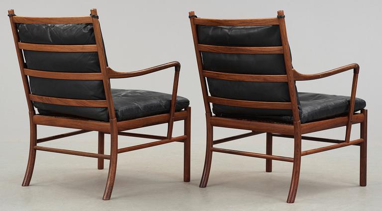 A pair of Ole Wanscher palisander and black leather 'Colonial Chairs, PJ 149', Poul Jeppesen, Denmark.