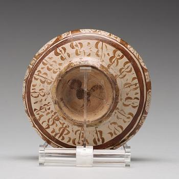 A BOWL, pottery with luster decor, height ca 10,5 cm, Persia/Iran 12th-13th century.