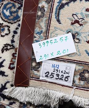 A Nain carpet, part silk, c. 291 x 201 cm.