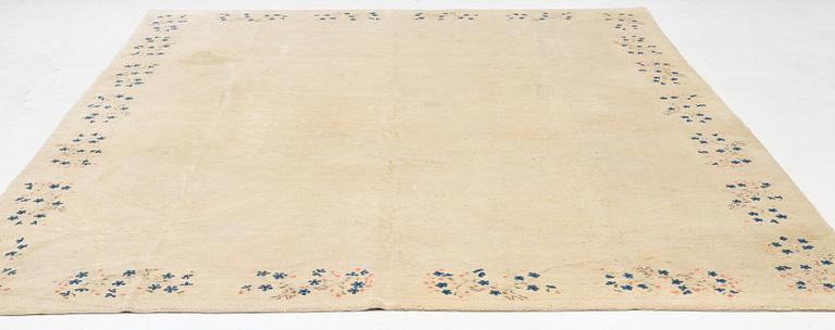 An Antique Peking rug, northern China, c 344 x 240 cm.