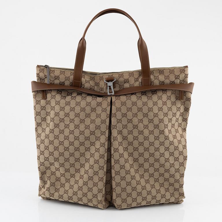 Gucci, a logo canvas tote bag.