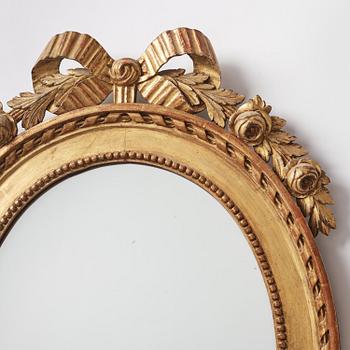 A pair of two-branch Gustavian-style giltwood mirrored girandoles, 19th century.