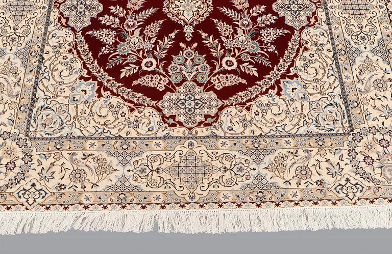 A carpet, Nain part silk s.k 6LAA, 239 x 155 cm.