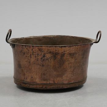 A 19th century copper cauldron.