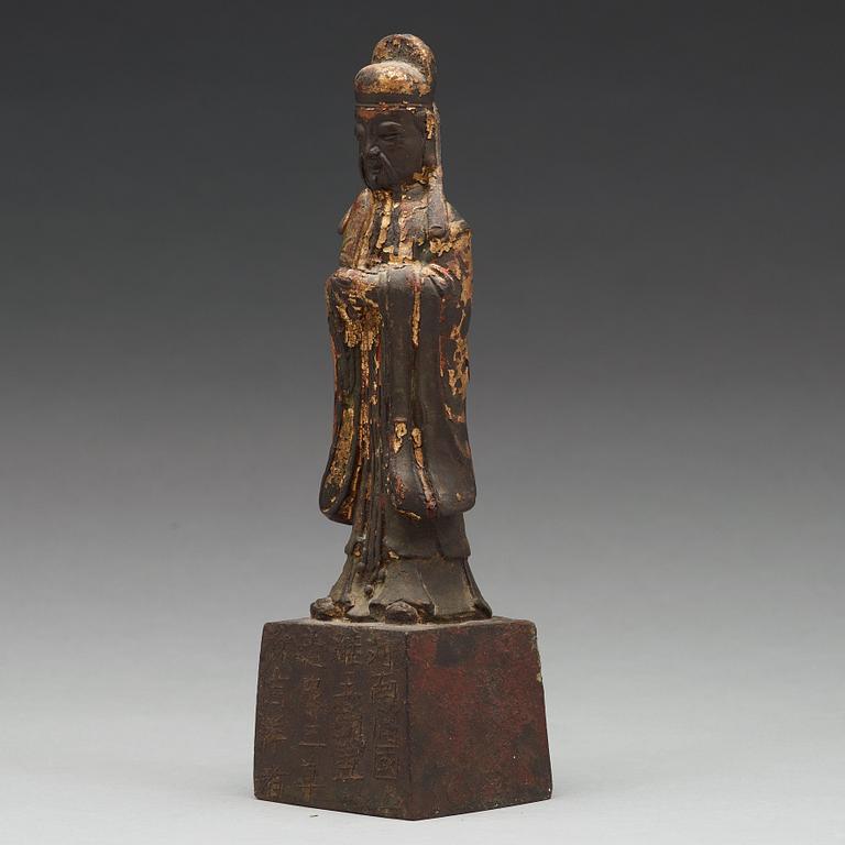 A copper alloy figure of a daoist dignitary, late Ming dynasty (1368-1644).