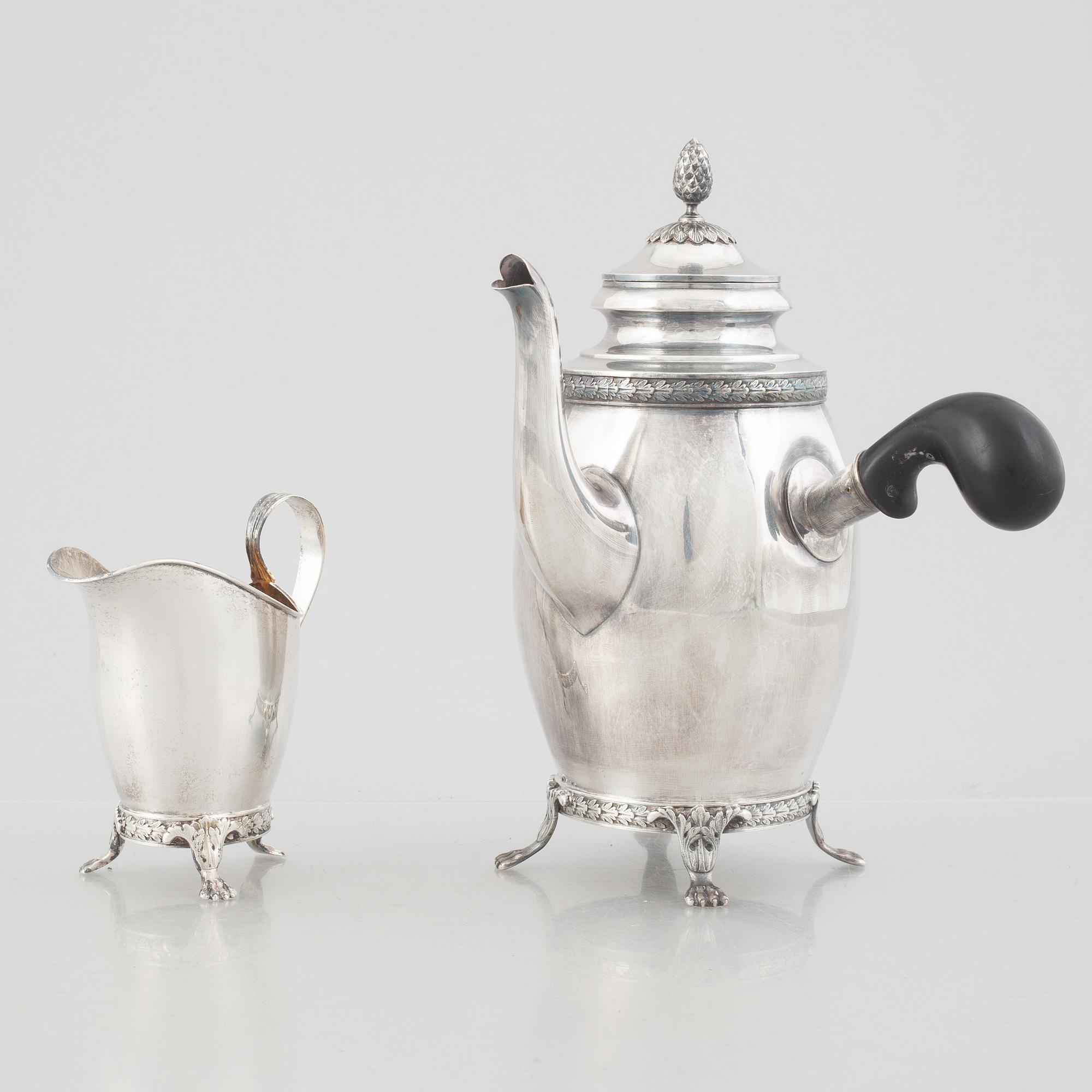 Carl Fredrik Carlman Company, a Gustavian style silver coffee pot and creamer, Stockholm, Sweden, 1915.