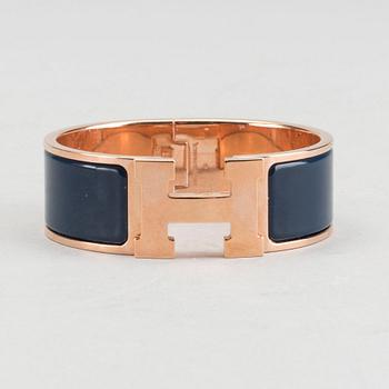A Hermès "Clic-H" bracelet.