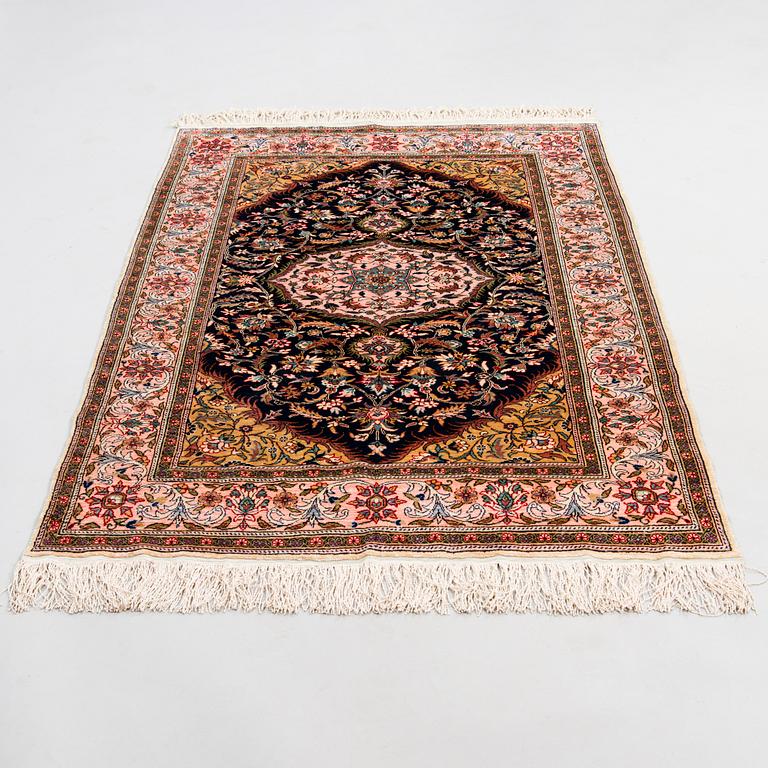 An Oriental silk carpet. Circa 150x103 cm.