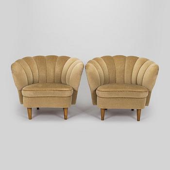 A pair of mid-20th century armchairs.