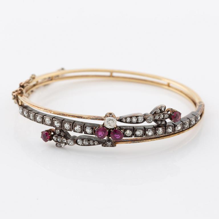 Arm ring in gold and silver set with old-cut and rose-cut diamonds and rubies.