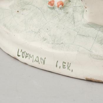 An earthenware figurine signed by Löfman.