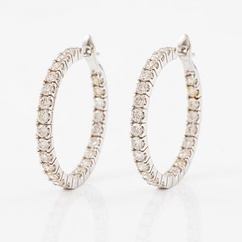 Earrings, a pair, hoops in 18K white gold set with brilliant-cut diamonds.
