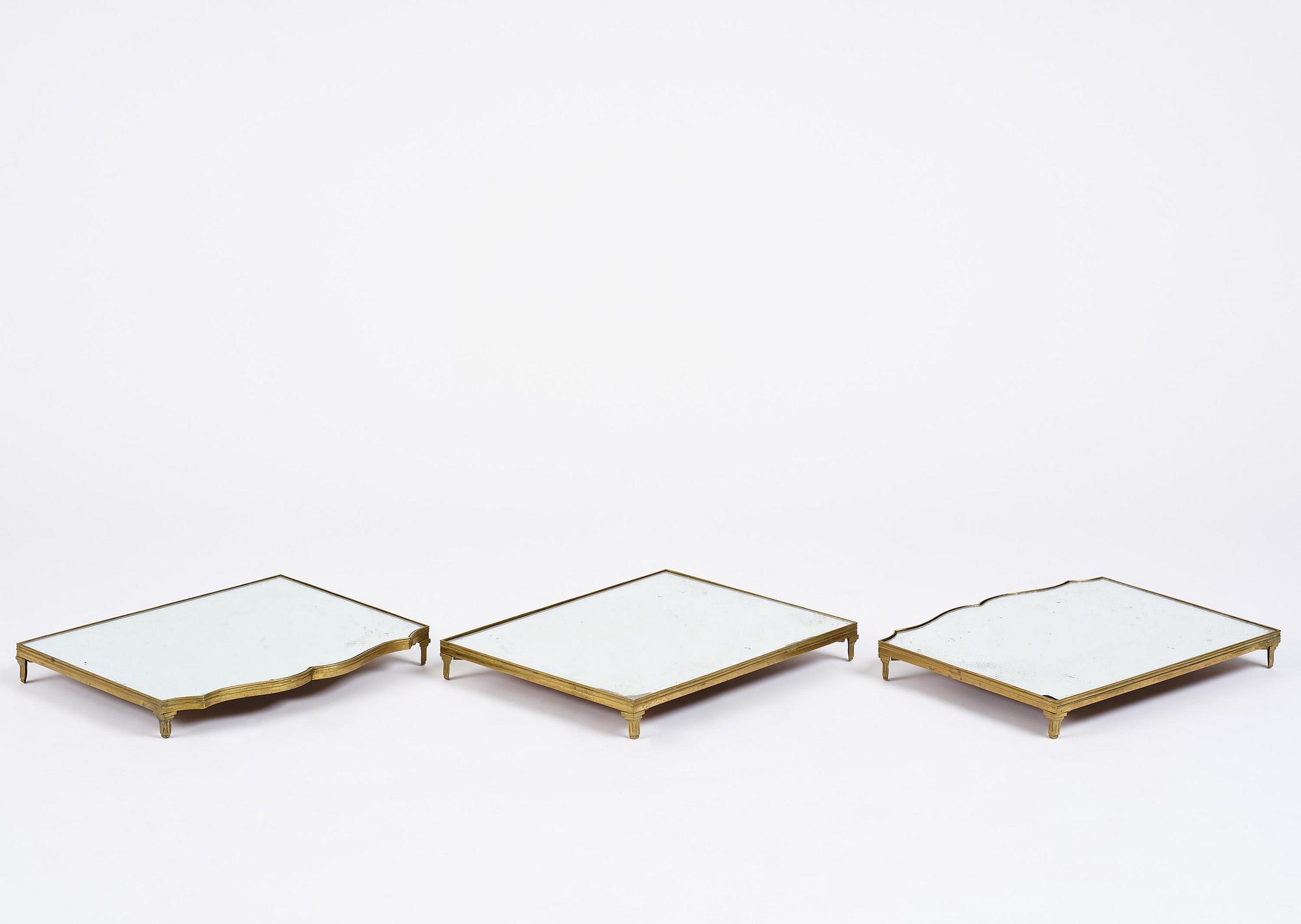 A Gustavian three-piece brass and glass surtout de table, Stockholm, later part 18th century.
