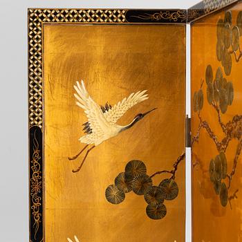 A Chinese lacquer folding screen, 20th century.