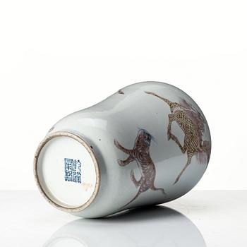 A iron red decorated vase, late Qing dynasty with seal mark to base.