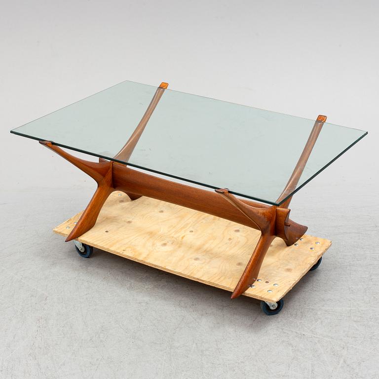 A glass top coffee table by Fredrik Schriever Abeln.