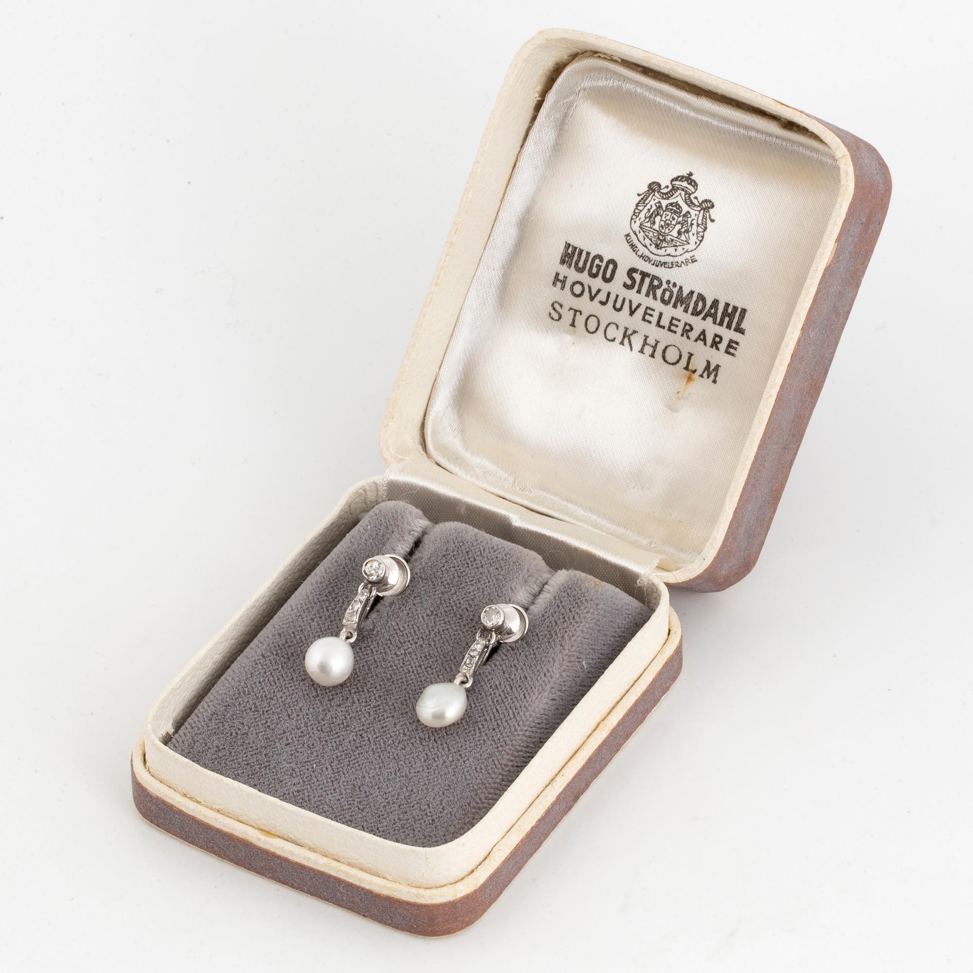 18K white gold and pearl and old-cut and rose-cut diamond earrings.