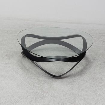 a "Newton" coffee table designed by Dan Sunaga & Staffan Holm in 2009.