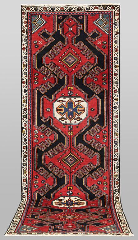 A semi-antique runner carpet, 295 x 100 cm.
