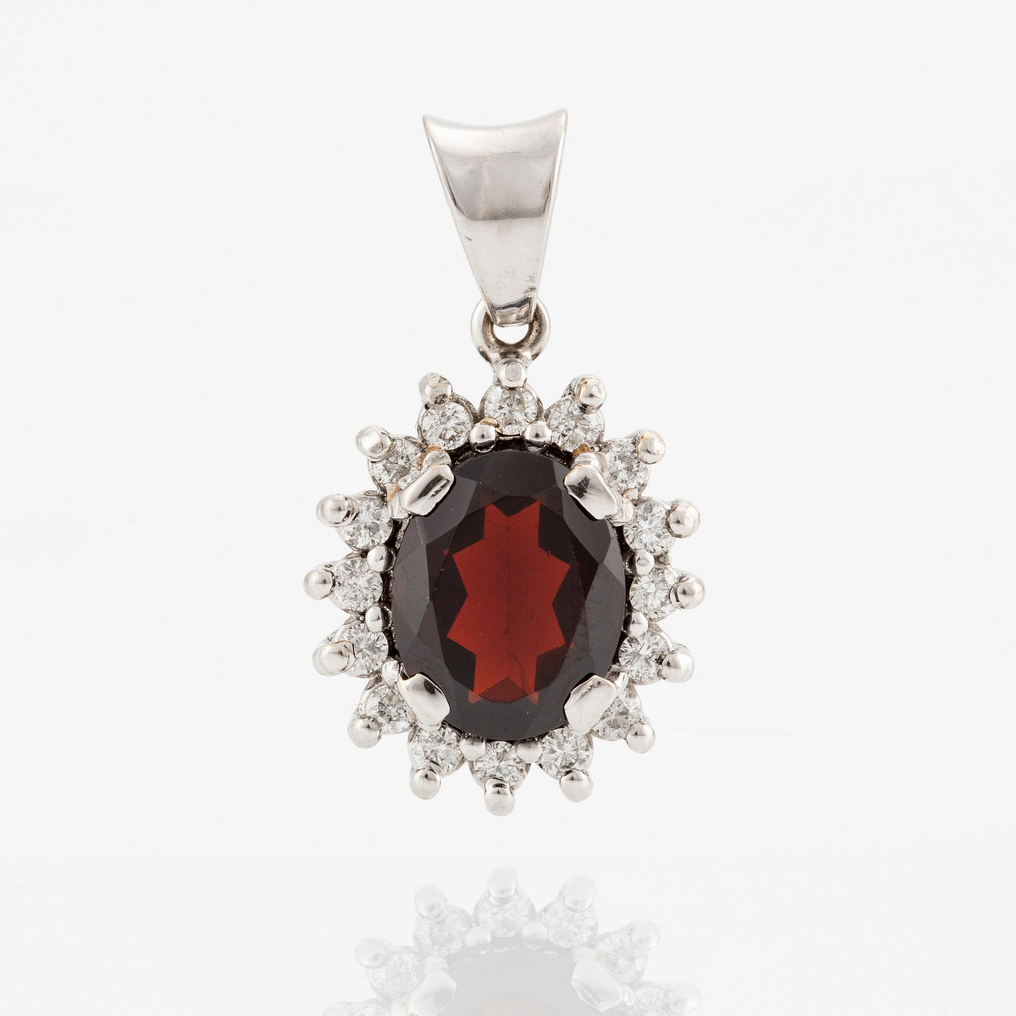 White gold pendant with garnet and brilliant-cut diamonds.