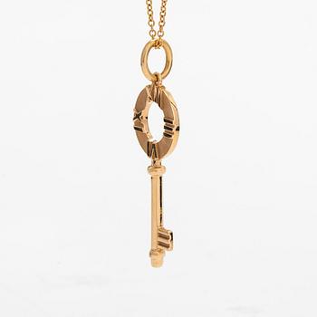 Tiffany & Co, an 18K gold 'Atlas Key' pendant with chain.