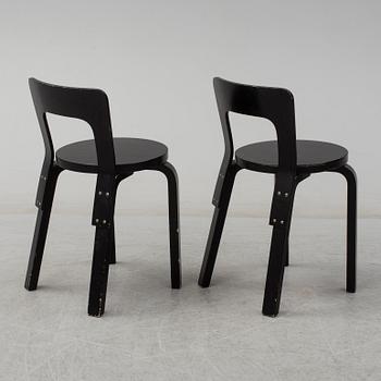 ALVAR AALTO, a pair of painted model 65 chairs from Artek, Finland.