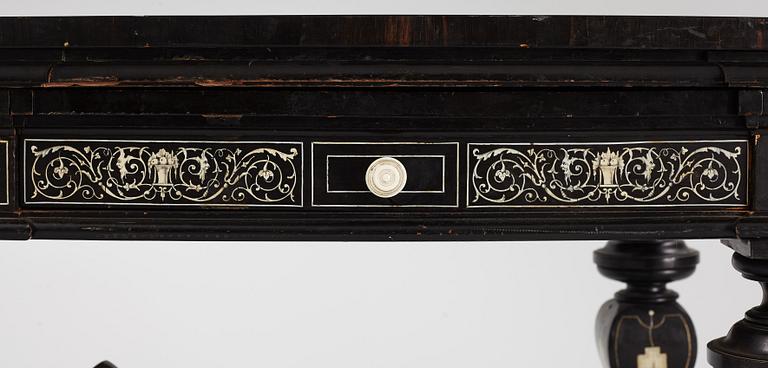 A Renaissance-style ebony, ebonized and ivory-inlaid library table, late 19th century, presumably Germany.