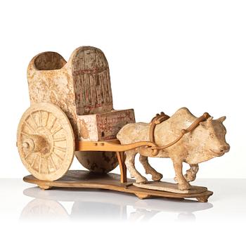 A pottery model of an ox with cart, Tang dynasty (618-907).
