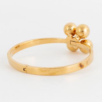 ARMRING, 18K guld med briljantslipad diamant, Design Relo Luzern.