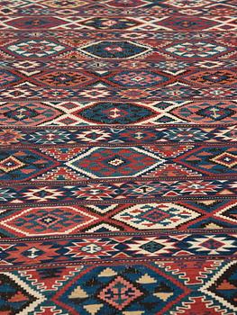 A CARPET, AN ANTIQUE AZERI KILIM, probably a Shirvan, ca 250 x 117,5 cm.