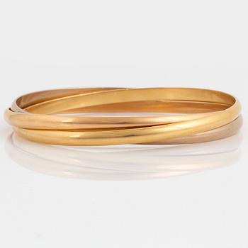 A Cartier "Trinity" bangle.