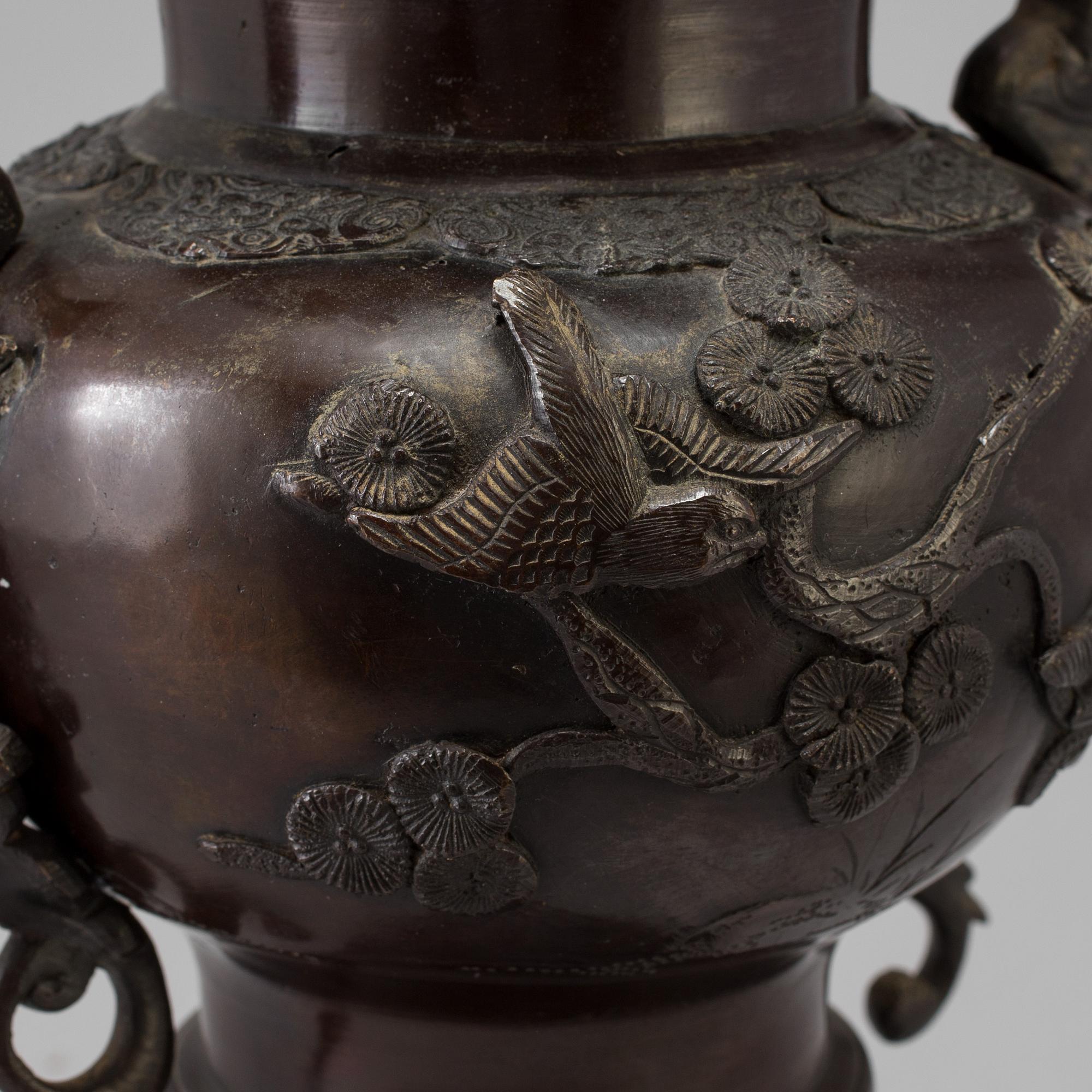 A Japanese bronze vase and cover, Meiji, late 19th century.