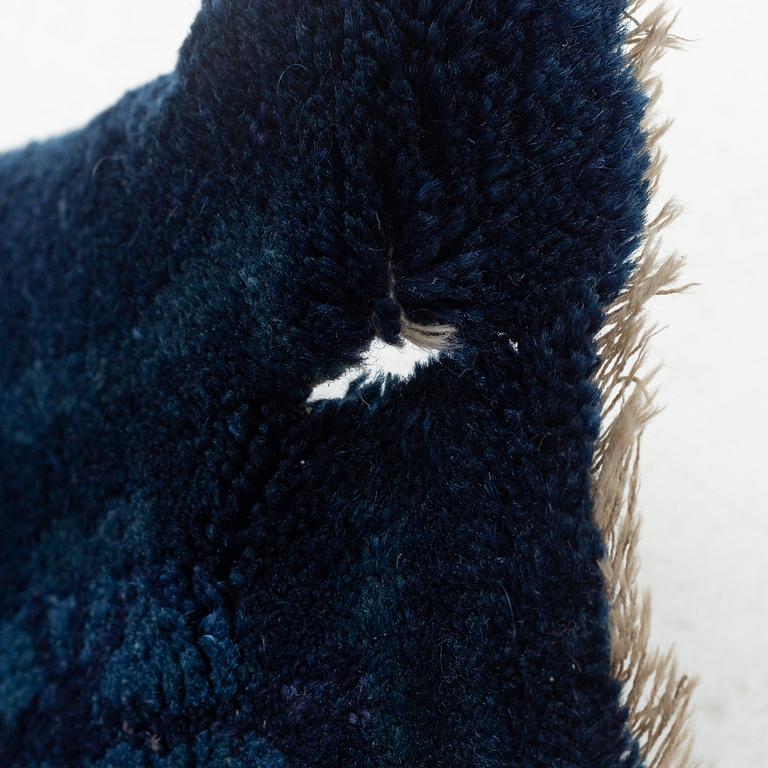 A semi antique/antique Baotou rug, China, c. 265 x 175 cm.