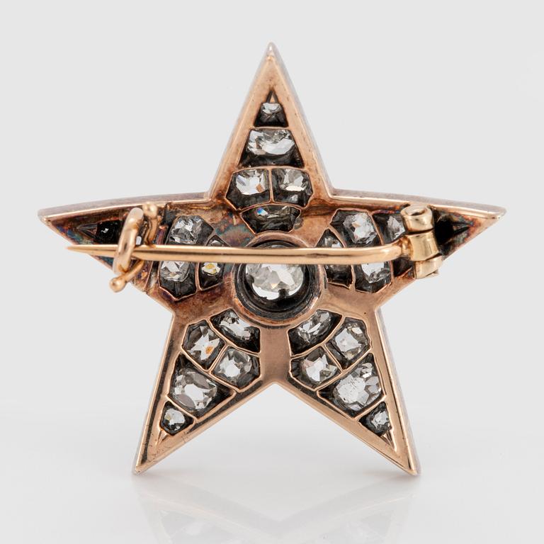 Brosch i form av stjärna silver och 14K guld med gammalslipade diamanter.