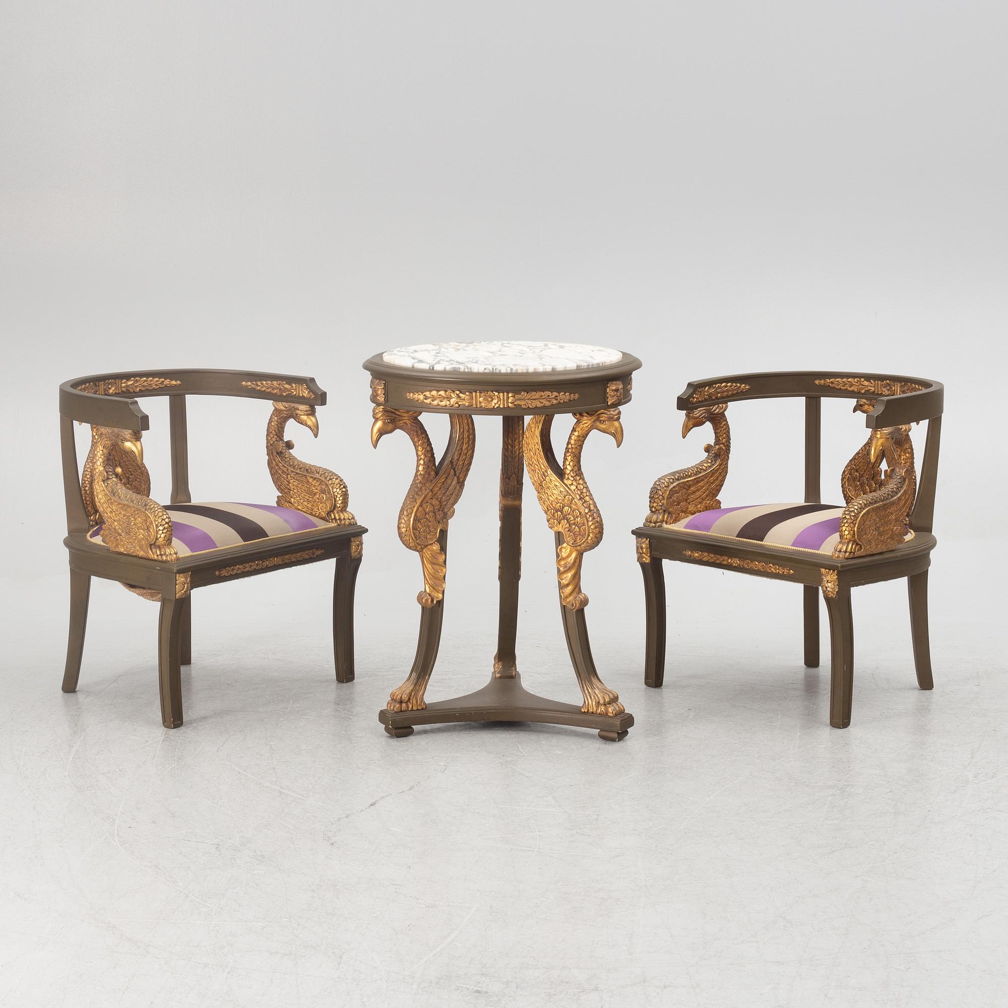 A pair of chairs and a side table, second half of the 20th century. Empire style.