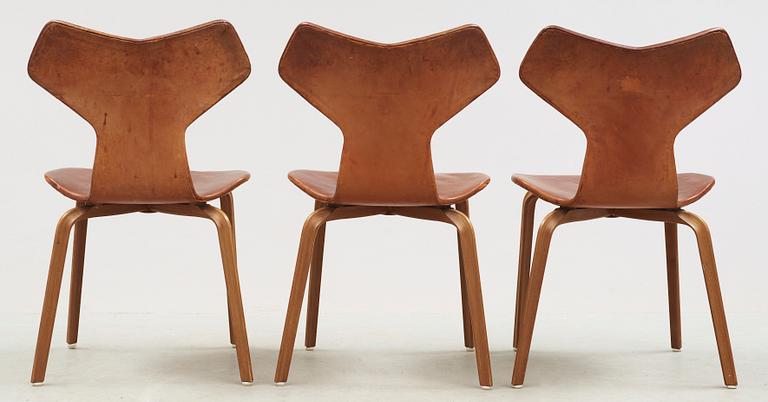 Three Arne Jacobsen teak and brown leather 'Grand Prix' chairs, Fritz Hansen, Denmark 1950's-60's.