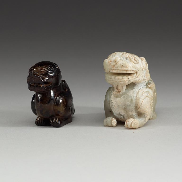 Two Chinese stone figures of mythical beasts.