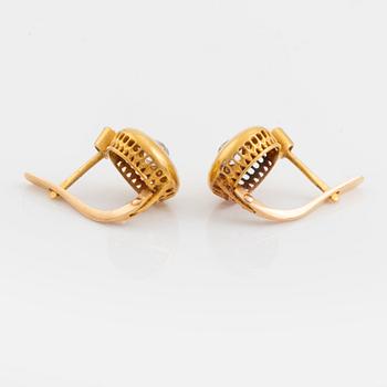A pair of 18K gold earrings set with old-cut diamonds.