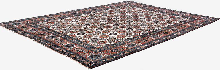 An antique Veramin carpet, West Persia, 380 x 271 cm.