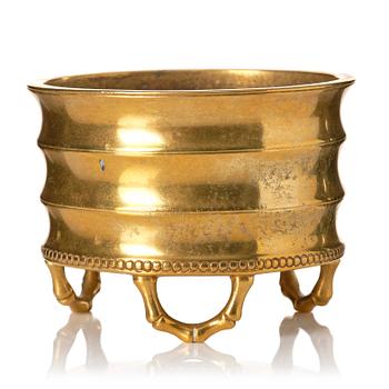 955. A gilt bronze tripod censer, Qing dynasty, possibly 18th Century.