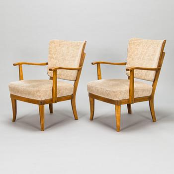 Einari Kyöstilä, a pair of 1940s open armchairs for Oy Stockmann Ab, Keravan Puusepäntehdas, Finland.