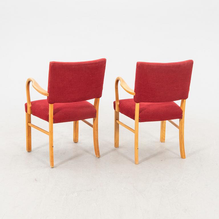 A pair of 1940s armchairs.