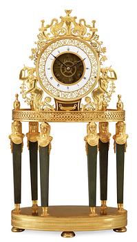 A French Empire gilt bronze mantel clock by L Grognot.