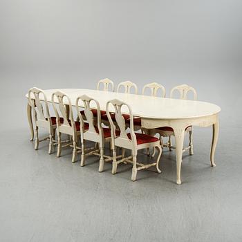 A rococo style dining set with a around table and eight chairs, 20th Century.