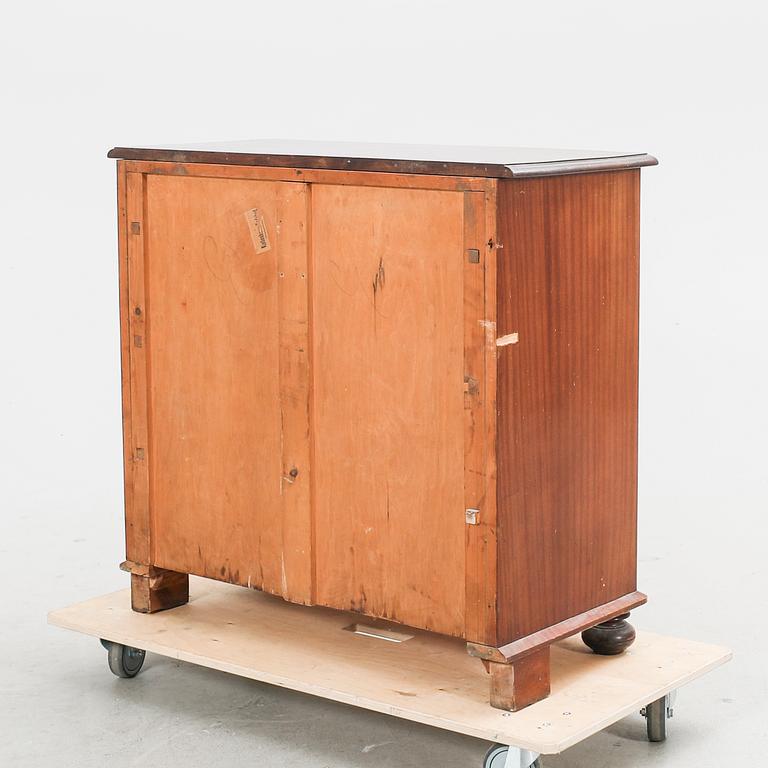 An early 1900s mahogany dresser.