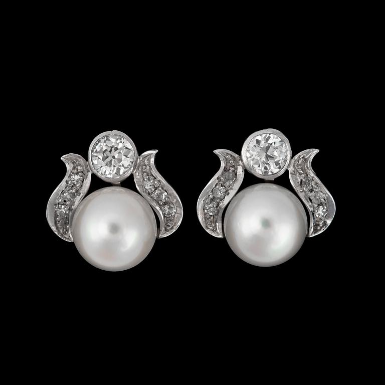 A pair of cultured pearl, 8.3 mm, and diamonds tot. ca 0.65 ct, earrings.